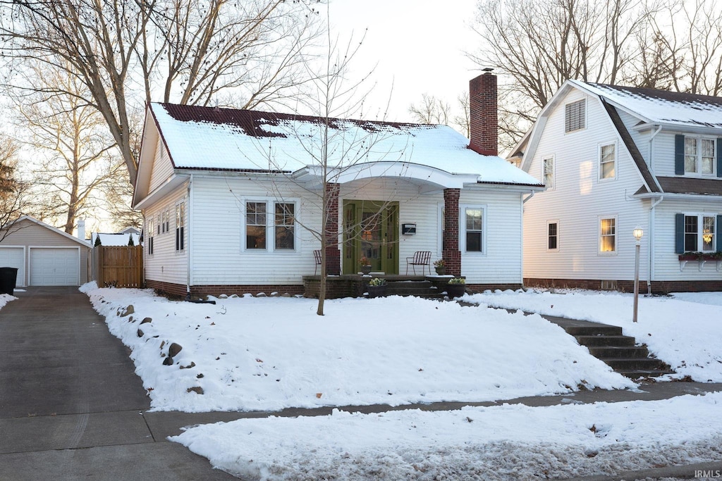 view of front of property with an outbuilding and a garage