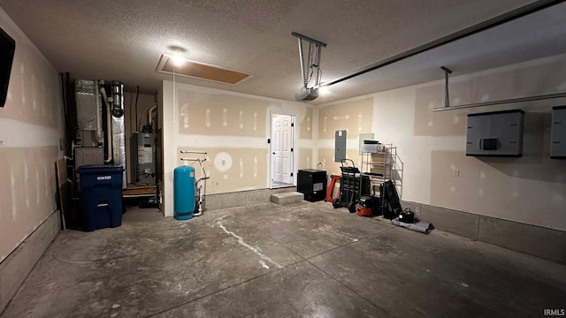 garage with gas water heater, a garage door opener, and electric panel