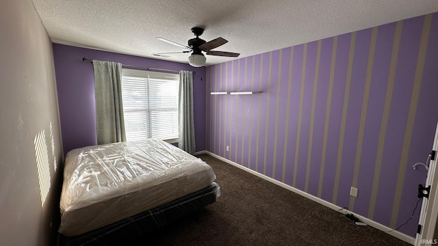 bedroom featuring carpet flooring, ceiling fan, and a textured ceiling