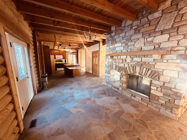 interior space featuring beam ceiling and wood ceiling