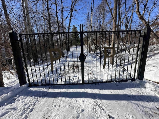 view of snow covered gate