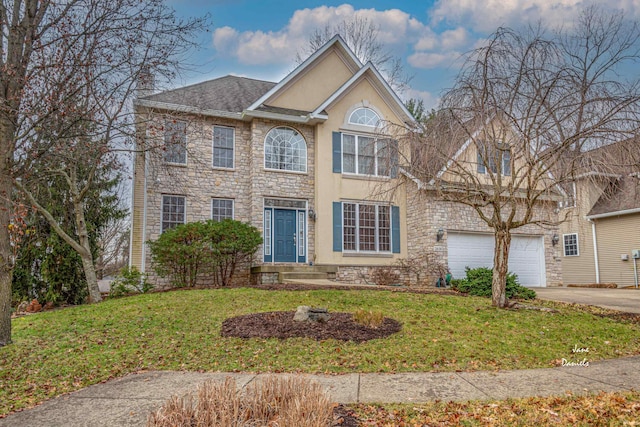 view of front of property with a front yard and a garage