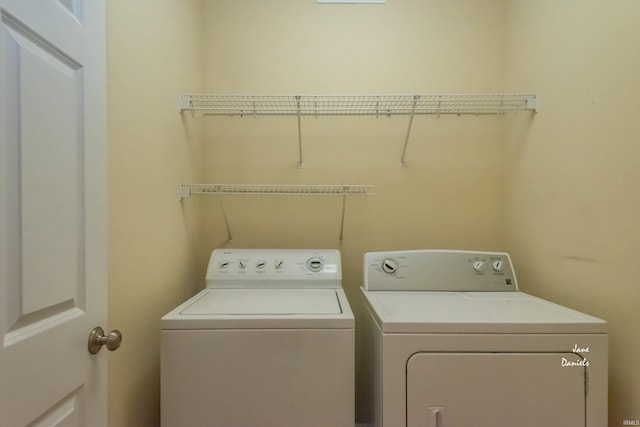 clothes washing area featuring washing machine and dryer