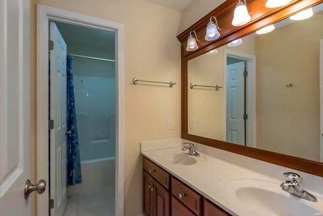 bathroom with tile patterned floors and vanity