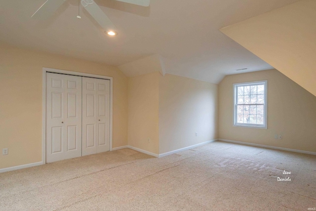 additional living space featuring lofted ceiling, carpet floors, and ceiling fan