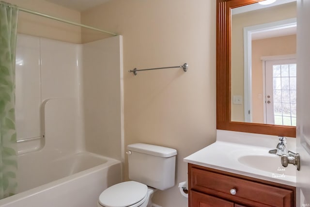 full bathroom with toilet, shower / bath combo with shower curtain, and vanity