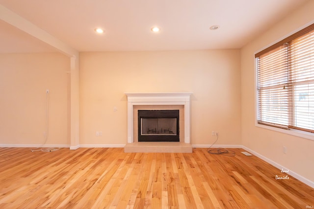 unfurnished living room featuring light wood-type flooring