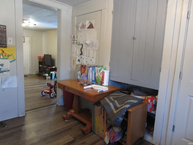 interior space with dark hardwood / wood-style flooring and a textured ceiling