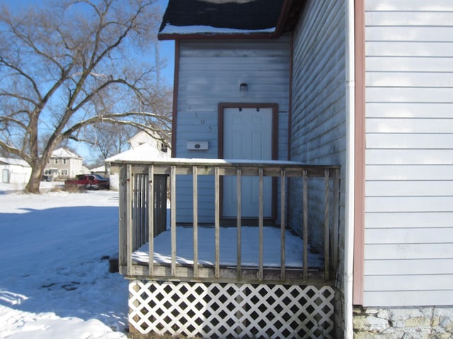 view of snow covered property entrance