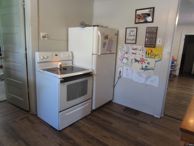 kitchen featuring white cabinets, white appliances, and dark hardwood / wood-style floors