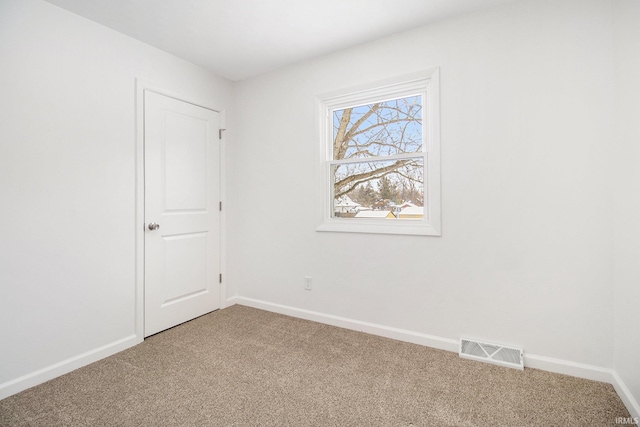 view of carpeted spare room