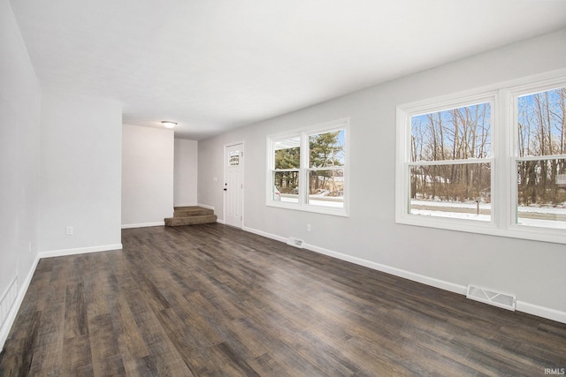 empty room featuring dark wood-type flooring