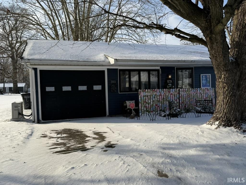 ranch-style home featuring a garage