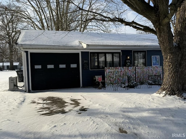 ranch-style home featuring a garage