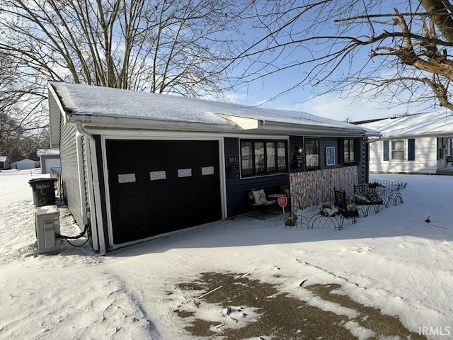 single story home with a garage