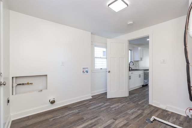 laundry room featuring washer hookup, dark hardwood / wood-style flooring, and sink