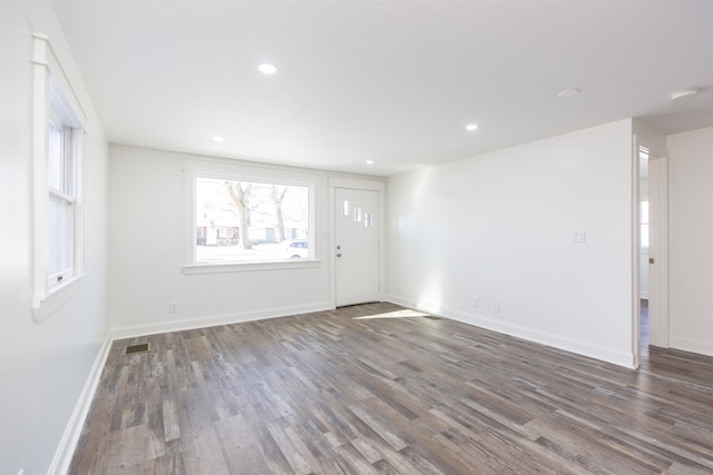 interior space with dark hardwood / wood-style flooring