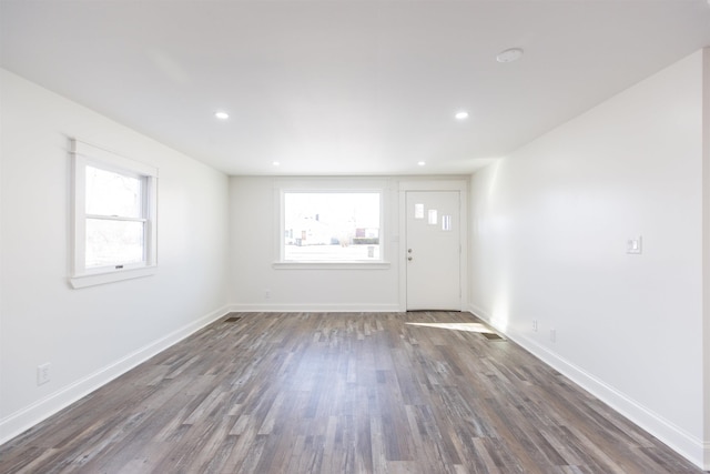 empty room featuring dark wood-type flooring