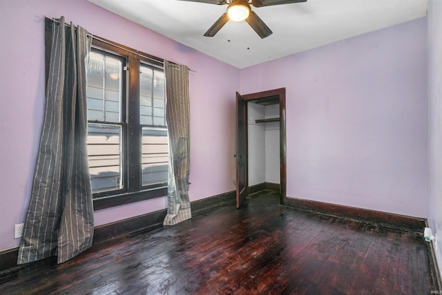 unfurnished bedroom featuring a closet, hardwood / wood-style flooring, and ceiling fan