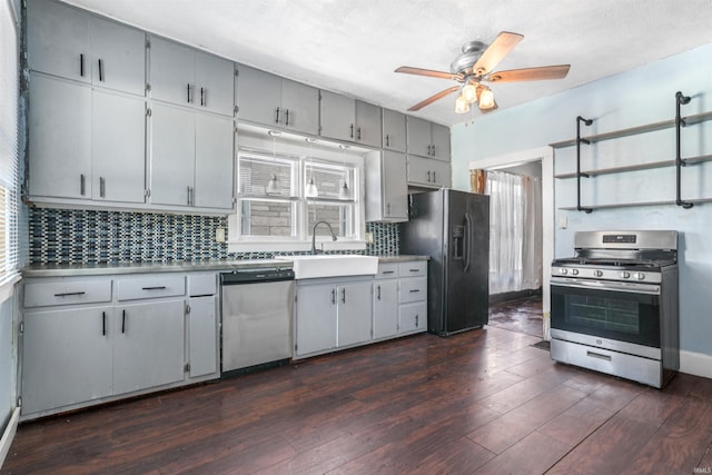 kitchen featuring decorative backsplash, sink, dark wood-type flooring, and appliances with stainless steel finishes