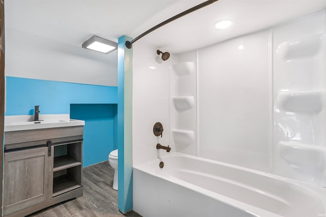 full bathroom with vanity, lofted ceiling, bathing tub / shower combination, toilet, and wood-type flooring