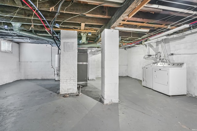 basement featuring washer and dryer and gas water heater