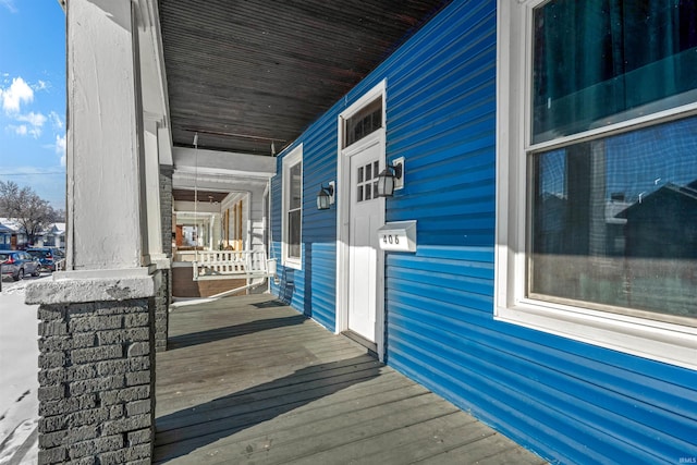 wooden terrace with covered porch