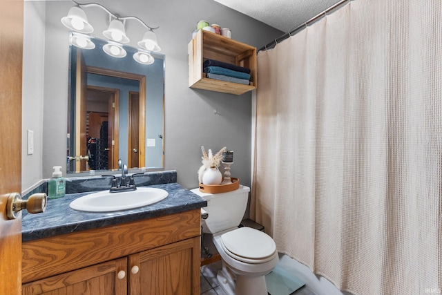 bathroom featuring vanity, a shower with shower curtain, a textured ceiling, and toilet