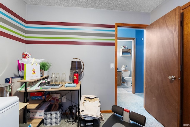 interior space with a textured ceiling and light colored carpet