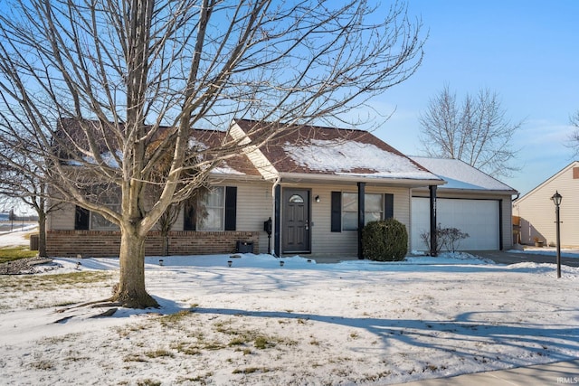 ranch-style house featuring a garage