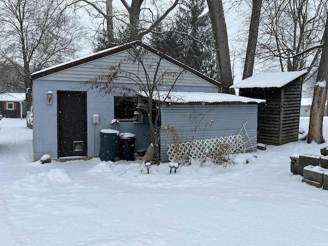 view of snow covered garage