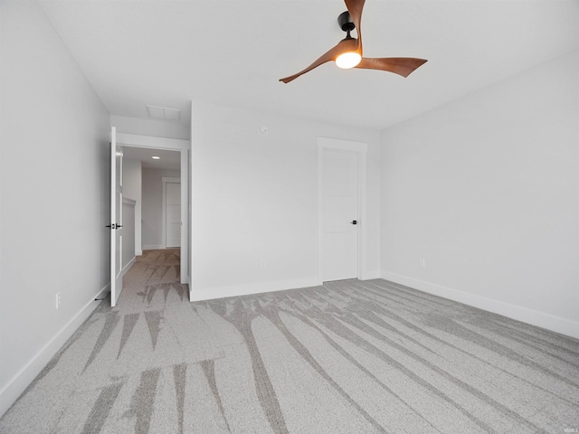 unfurnished room featuring light carpet and ceiling fan