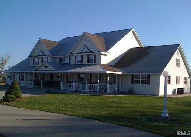 view of front facade with covered porch and a front yard