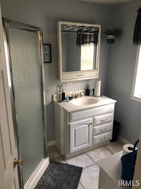 2893 S US Route 31, Peru, IN 46970 - bathroom featuring vanity, tile patterned floors, and a shower with shower door