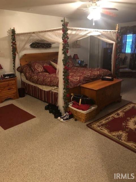 2893 S US Route 31, Peru, IN 46970 - carpeted bedroom featuring ceiling fan