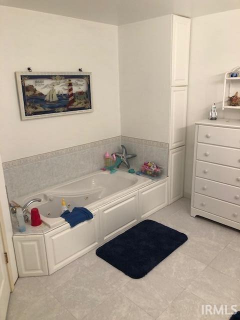 2893 S US Route 31, Peru, IN 46970 - bathroom with a tub to relax in and tile patterned flooring