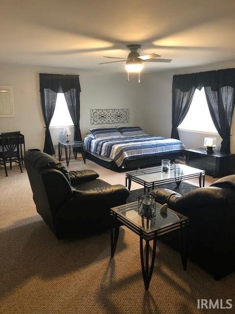 2893 S US Route 31, Peru, IN 46970 - carpeted bedroom featuring ceiling fan