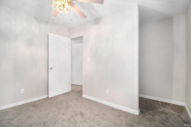 carpeted empty room with ceiling fan