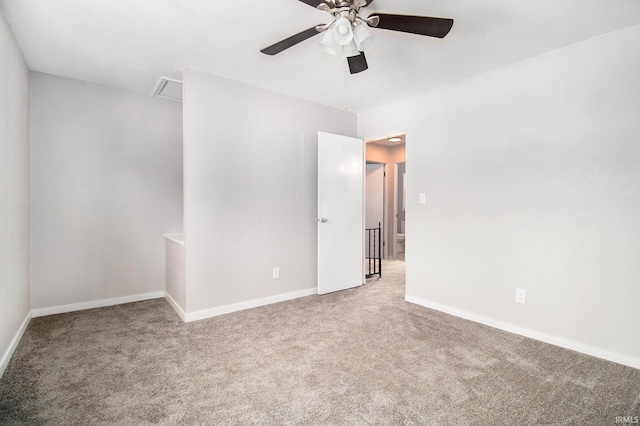 carpeted empty room with ceiling fan