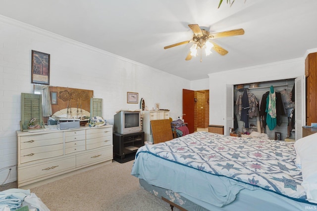 bedroom with ceiling fan, a closet, and ornamental molding