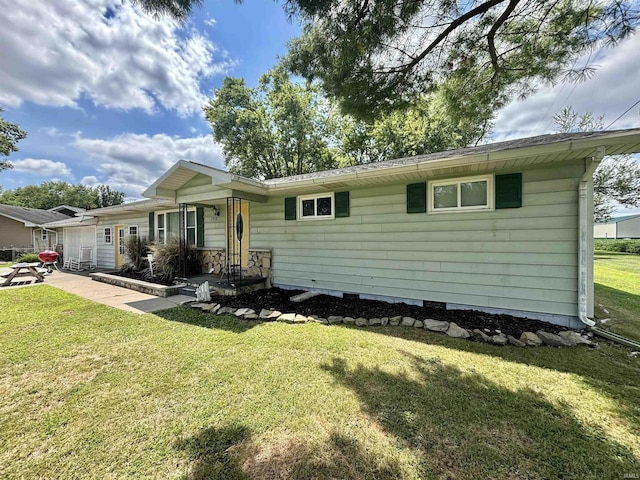 view of front of property with a front lawn and a patio