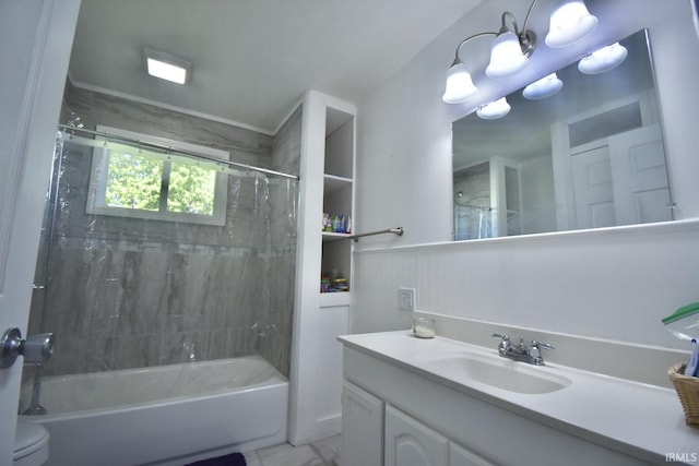 full bathroom with tiled shower / bath combo, toilet, and vanity