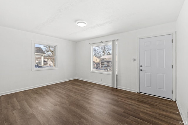 foyer with dark hardwood / wood-style floors