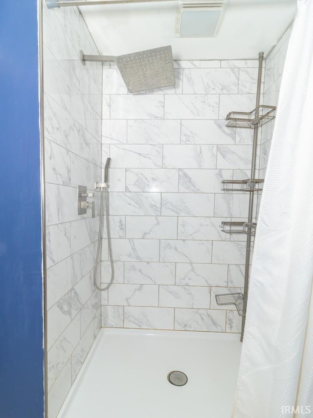 bathroom with a shower with curtain