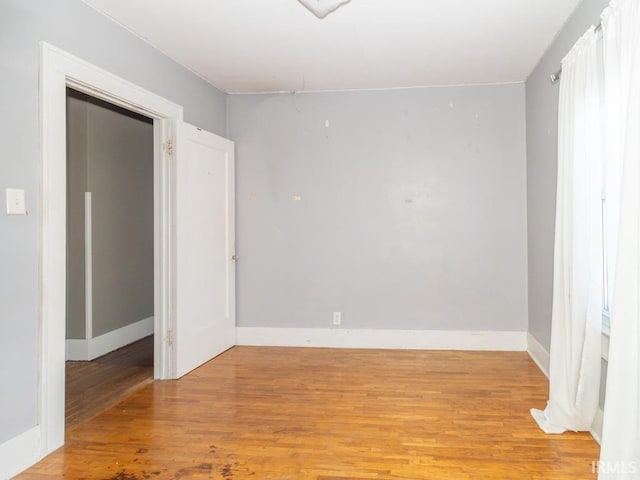 spare room with light wood-type flooring