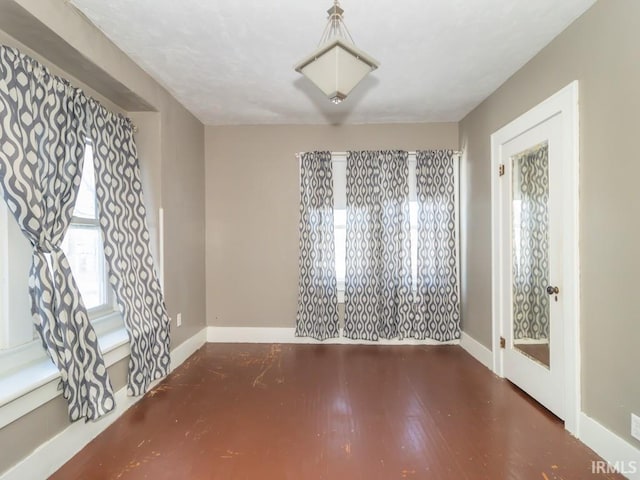 spare room with dark hardwood / wood-style flooring