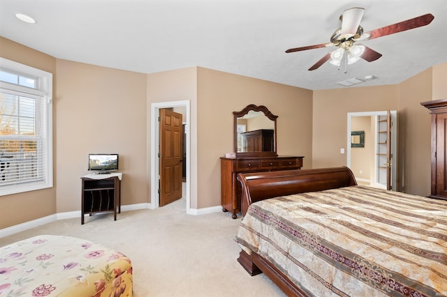 bedroom with light colored carpet and ceiling fan