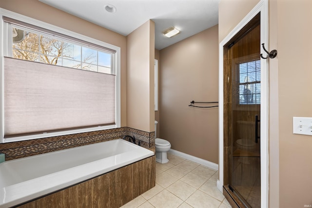 bathroom with toilet, tile patterned flooring, and separate shower and tub