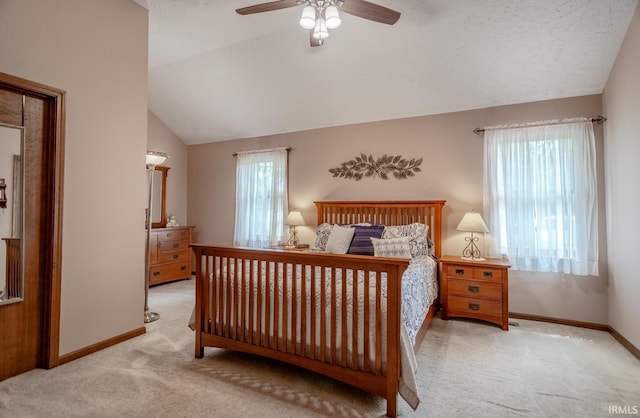 carpeted bedroom with lofted ceiling and ceiling fan