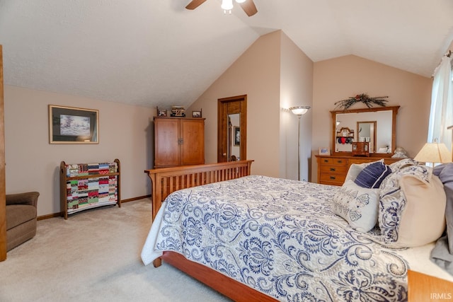 bedroom featuring ceiling fan, light colored carpet, and lofted ceiling